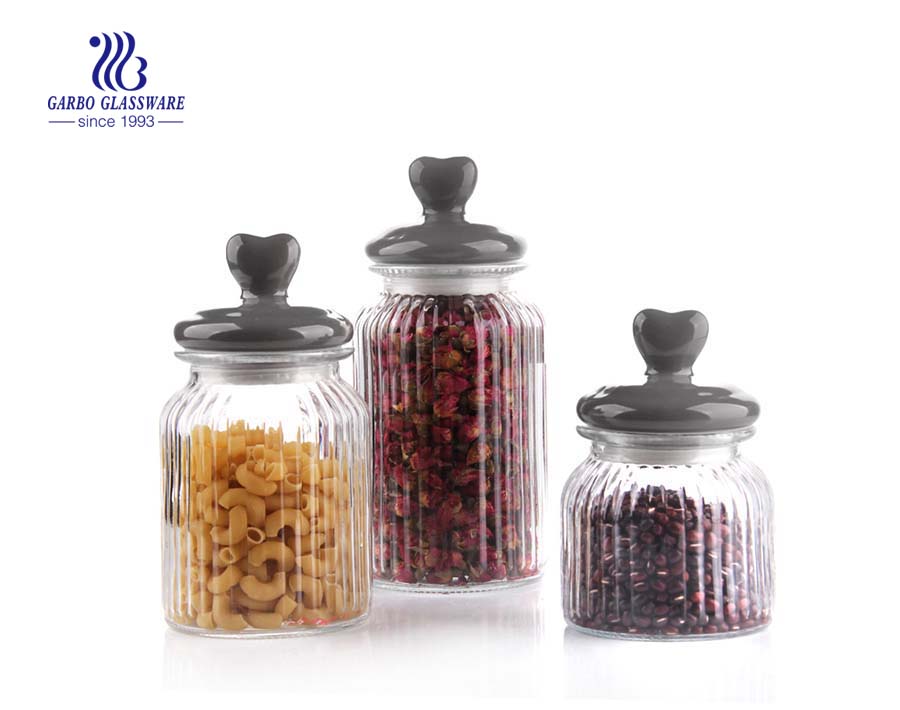 small glass candy storage jar witha black lid