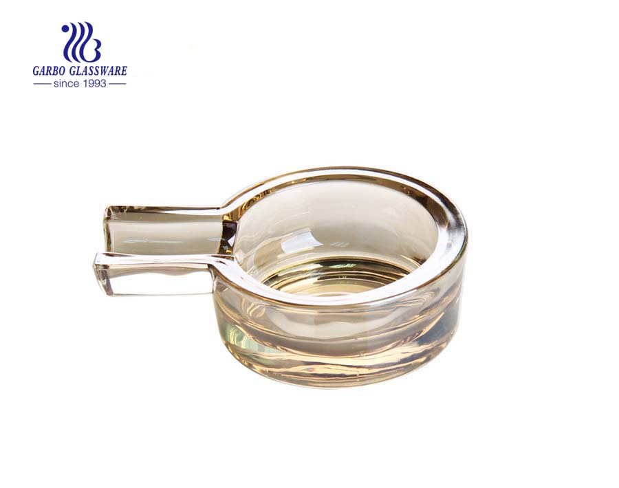 Amber color round glass ashtray for cigarette smoking