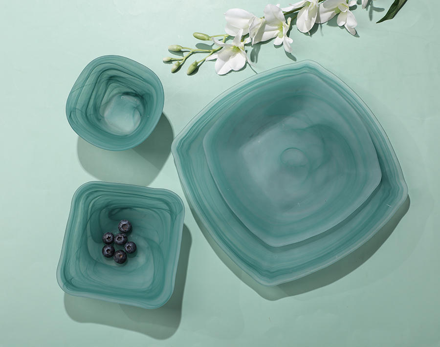 Colored glass bowls and plates showcase Chinese cultural style Colored glass bowls and plates showcase Chinese cultural style