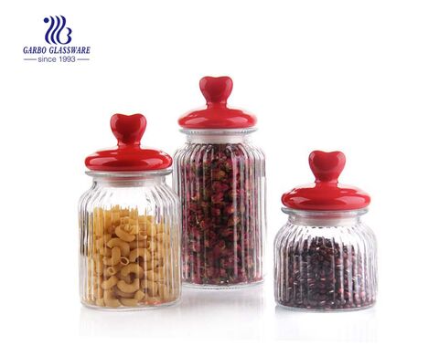  small glass candy storage jar with a gray lid 