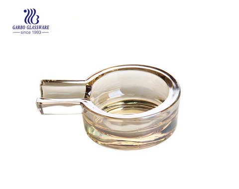 Amber color round glass ashtray for cigarette smoking 