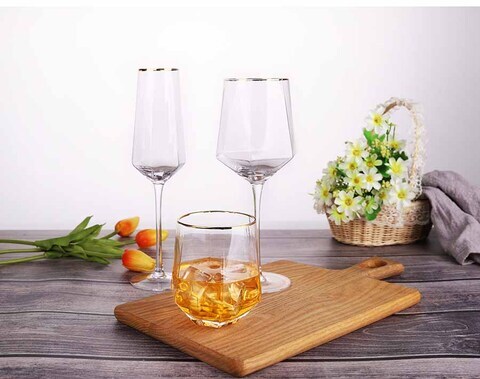 15.14 oz hand blown wine glass with hexagonal belly and gold rim mouth