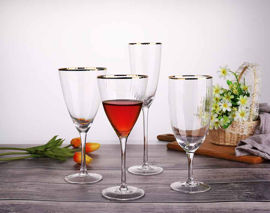 15.14 oz hand blown wine glass with hexagonal belly and gold rim mouth