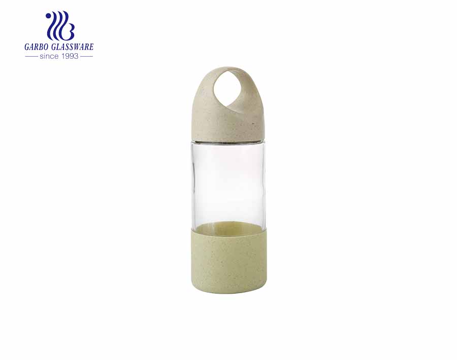 Wholesale cute design 380ml glass bottle with plastic sleeve and lid