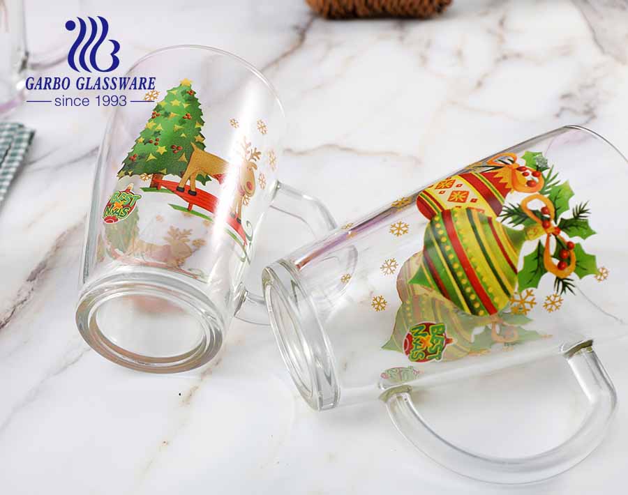 Tazas de té de cristal del diseño de la Navidad de 11.5oz con las tazas de cristal del diseño de encargo del logotipo del OEM de la manija