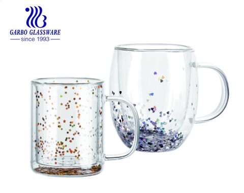 Double wall glass coffee tea mugs with floating shiny golden and iridescent glitter confetti 