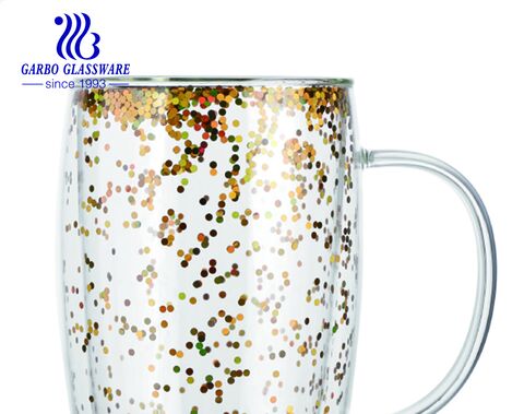 Double wall glass coffee tea mugs with floating shiny golden and iridescent glitter confetti 