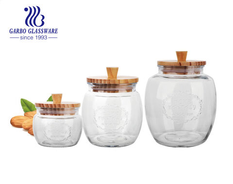 Wholesale machine-made multiple 3sizes cheap glass storage bottle round storage jar with wooden lid 