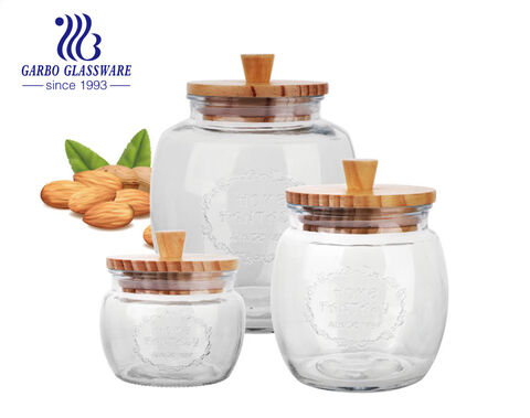 Wholesale machine-made multiple 3sizes cheap glass storage bottle round storage jar with wooden lid 