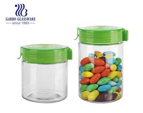 Tarro de almacenamiento de cacahuete de galleta de vidrio de 900 ml hecho a máquina con tapa de plástico a prueba de fugas de color de diseño personalizado