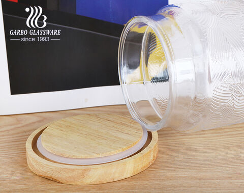 Tarro de almacenamiento de vidrio con patrón de estampado de hojas de botella de vidrio con tapa de bambú de 1250 ml