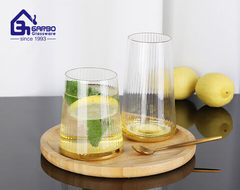 Luxury stemless wine glass golden base glass water tumbler