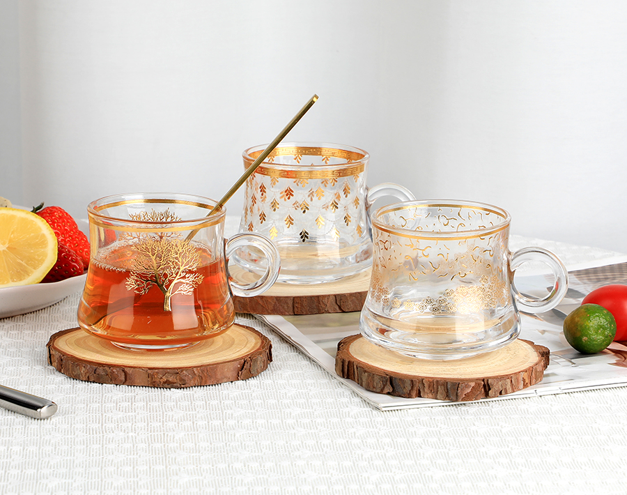 China 80ml hot sale round glass coffee mug with customized golden decal tree designs factory