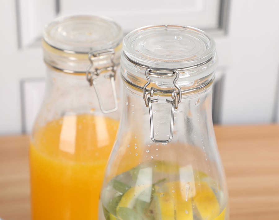 Wholesale glass water bottle with buckle lid for milk and juice