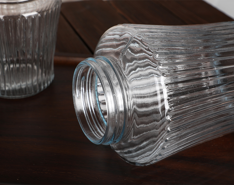 Wholesale cheap glass storage jar with vertical line design in promotion