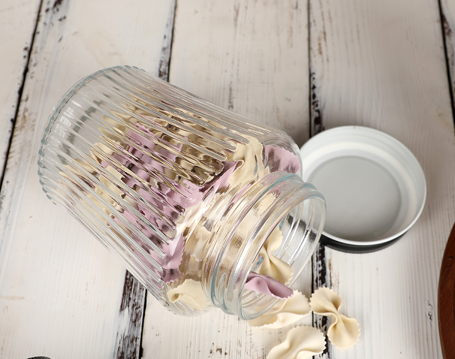 Wholesale cheap glass storage jar with vertical line design in promotion